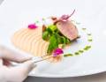 Chef decorating a dish